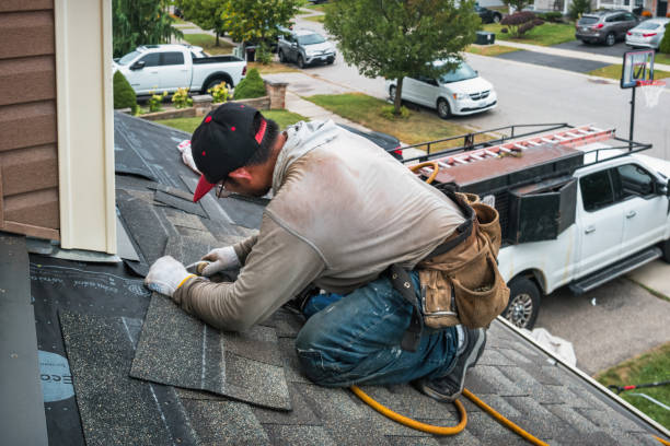 Professional Roofing technician working in Lansing, IA